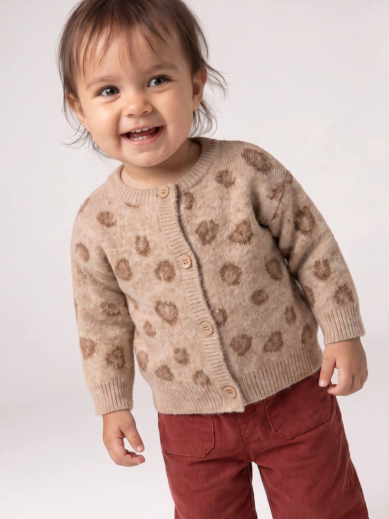 Gebreid babyvestje met knopen gemêleerd beige