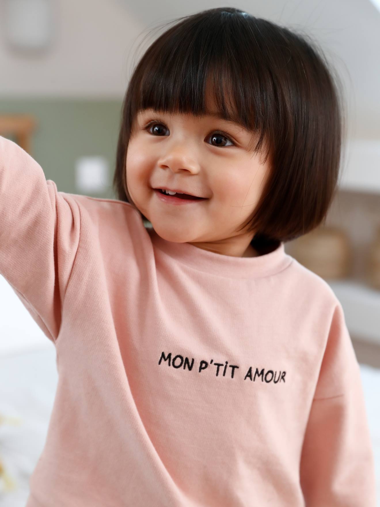 Aanpasbaar sweatshirt voor baby met boodschap poederroze