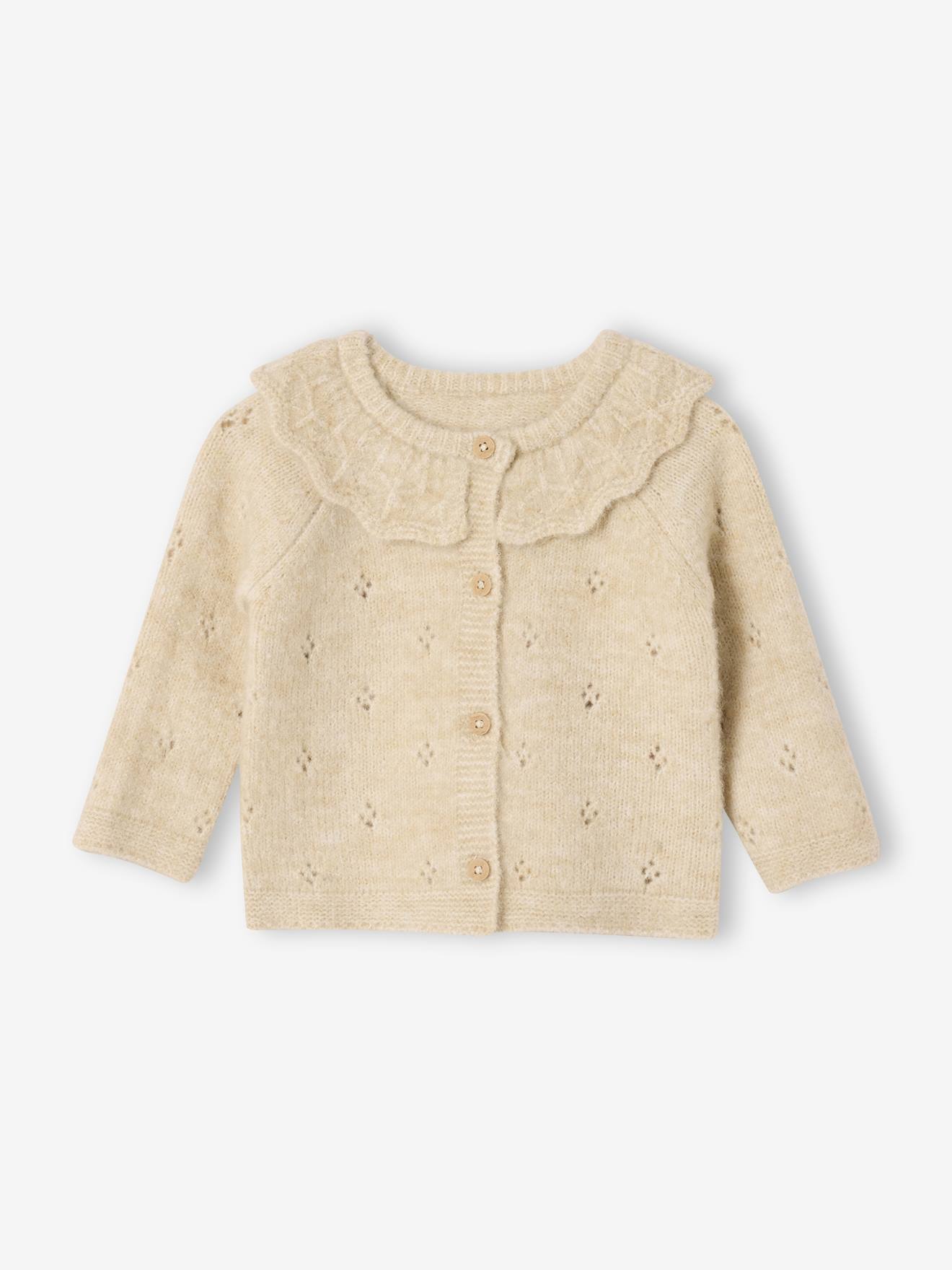 Gebreid vestje voor pasgeborenen in fantasie breisel met ruches. gemêleerd beige afbeelding